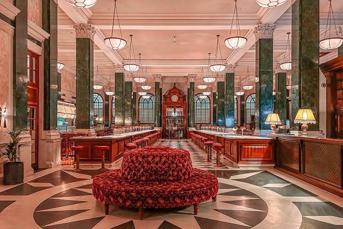 A high room in an art hotel, with the original structure of the building left visible.