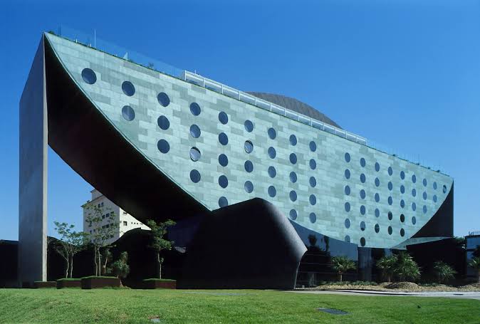 Hotel Unique in Sao Paulo, an inverted copper-clad arch with round windows set in a regular line.